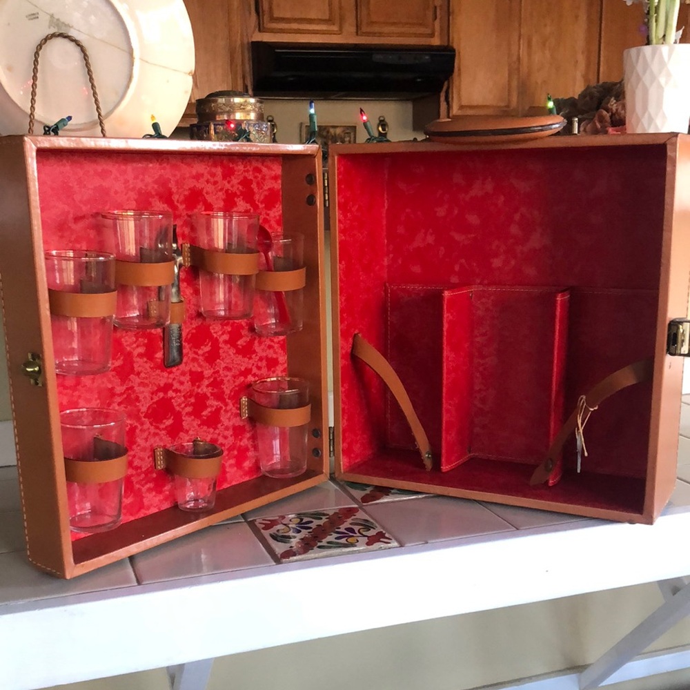 Leather travel bar with glasses and opener keys
